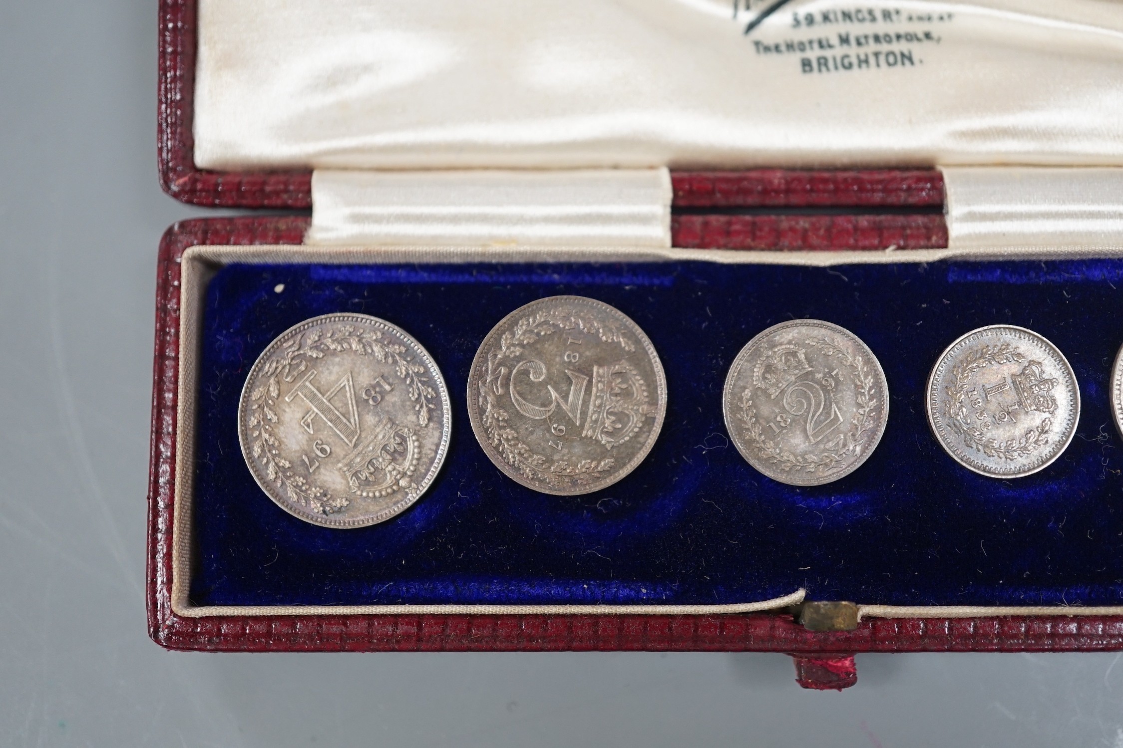 An 1897 cased maundy set and two other coins